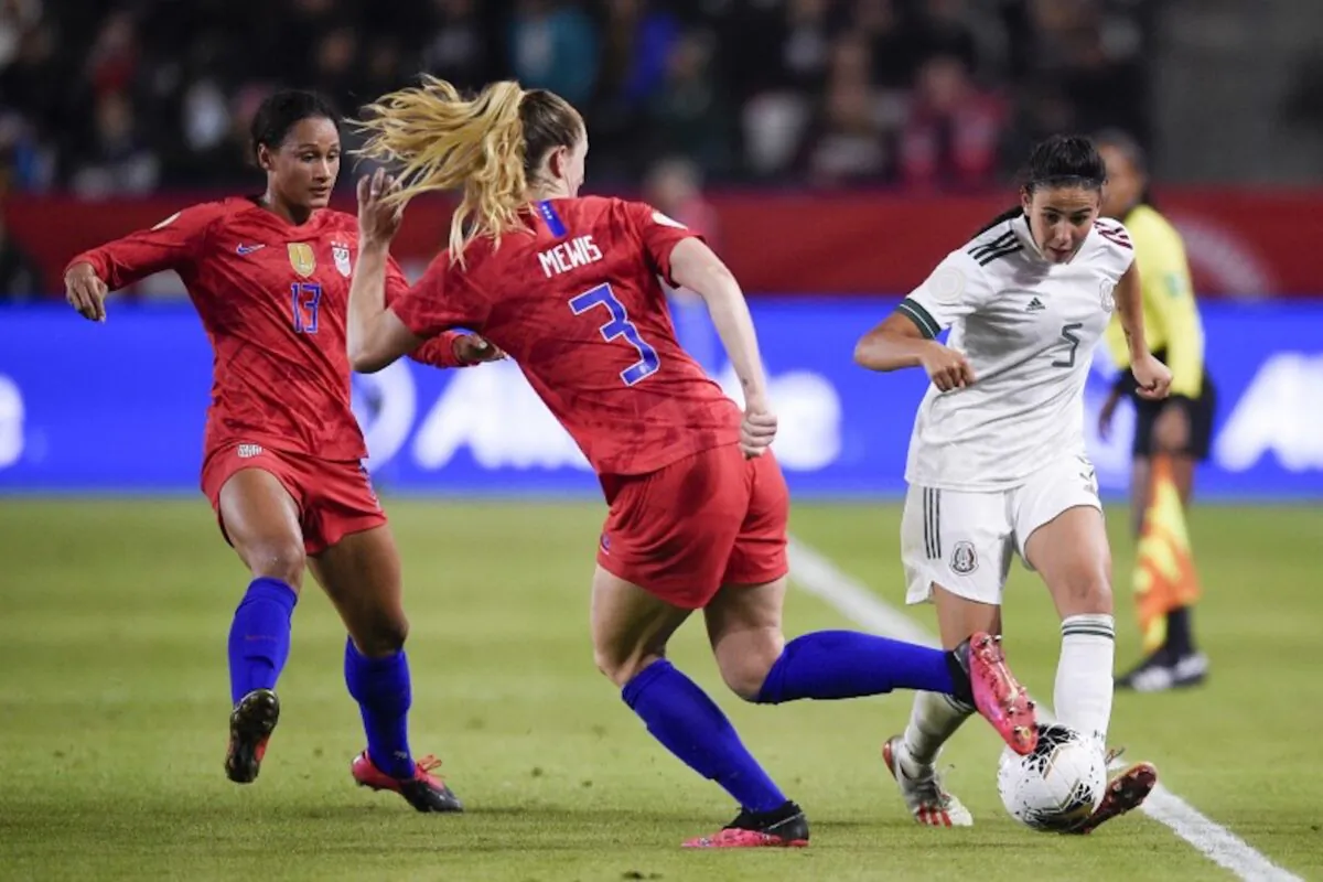 Feb 7, 2020; Los Angeles, California, USA; Mexico defender Jimena Lopez (5) passes the ball while United States midfielder Samantha Mewis (3) defends during the second half of the CONCACAF Women's Olympic Qualifying soccer tournament at Dignity Health Sports Park. (Photo by Kelvin Kuo-USA TODAY Sports)