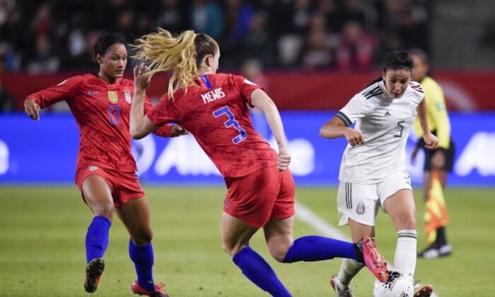 Feb 7, 2020; Los Angeles, California, USA; Mexico defender Jimena Lopez (5) passes the ball while United States midfielder Samantha Mewis (3) defends during the second half of the CONCACAF Women's Olympic Qualifying soccer tournament at Dignity Health Sports Park. (Photo by Kelvin Kuo-USA TODAY Sports)