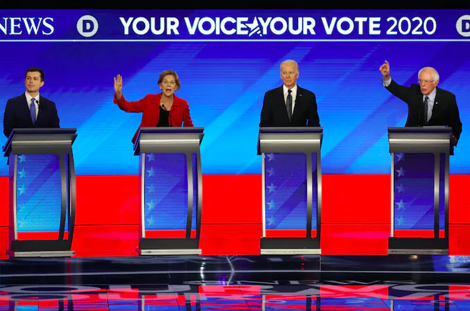 Democratic presidential candidates former South Bend, Indiana Mayor Pete Buttigieg, Sen. Elizabeth Warren (D-Mass.), former Vice President Joe Biden, and Sen. Bernie Sanders (I-Vt.) participate in the Democratic presidential primary debate in the Sullivan Arena at St. Anselm College on Feb. 7, 2020 in Manchester, New Hampshire. (Joe Raedle/Getty Images)