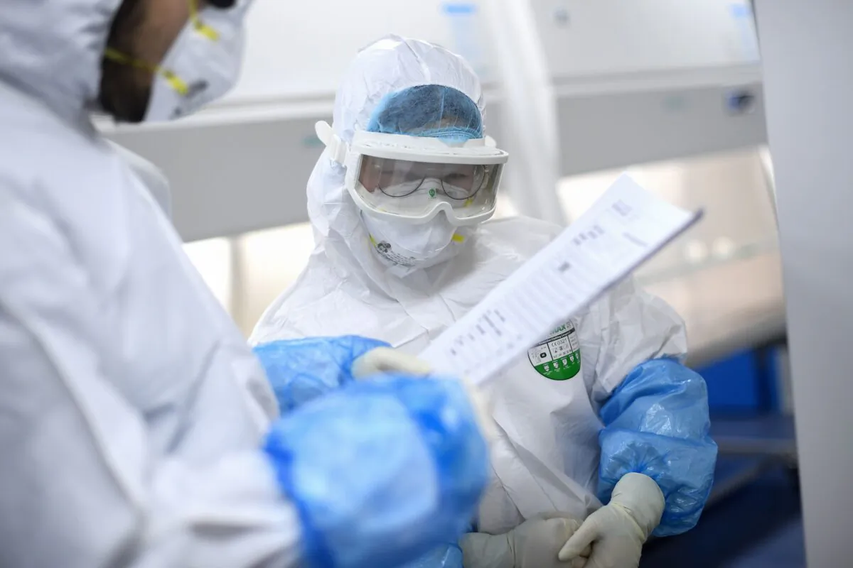Laboratory technicians at "Fire Eye" laboratory in Wuhan in central China's Hubei Province on Feb. 6, 2020. (STR/AFP via Getty Images)