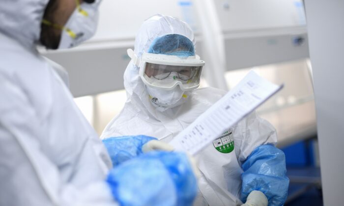 Laboratory technicians at "Fire Eye" laboratory in Wuhan in central China's Hubei Province on Feb. 6, 2020. (STR/AFP via Getty Images)