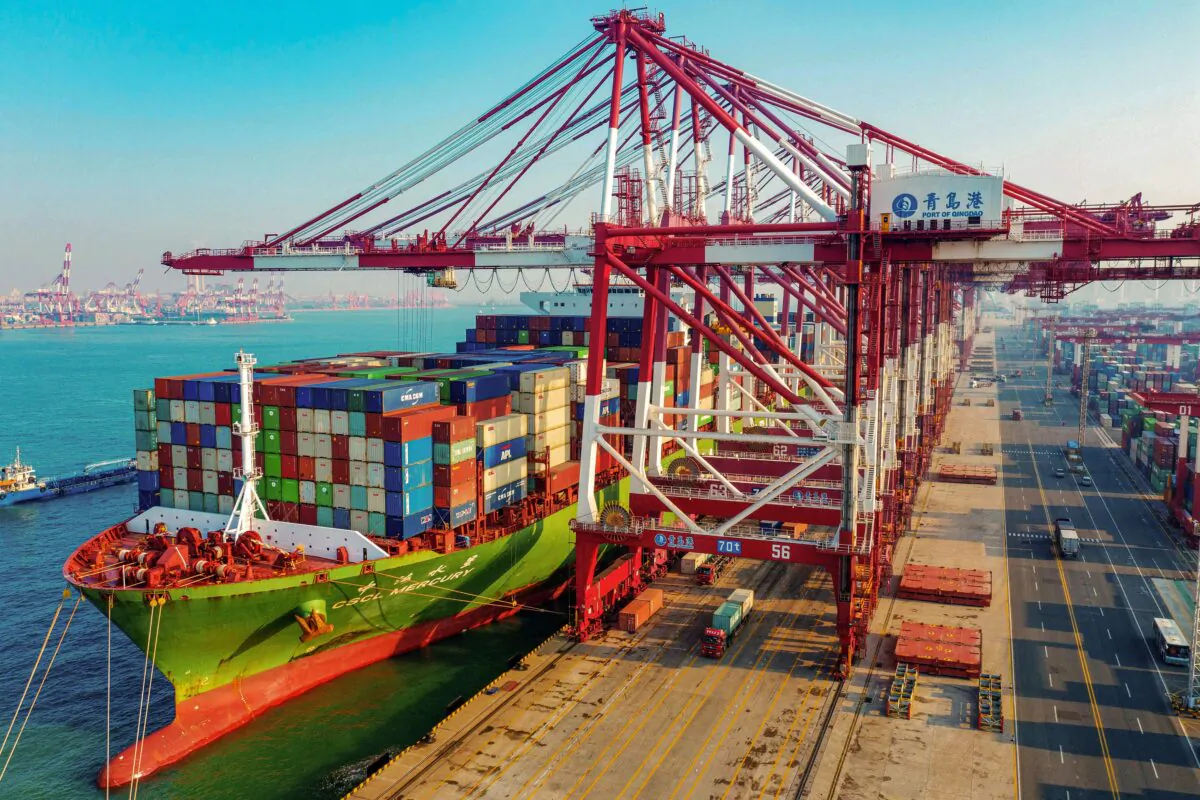 A cargo ship loaded with containers berths at a port in Qingdao in China's eastern Shandong Province on Jan. 14, 2020. (STR/AFP via Getty Images)