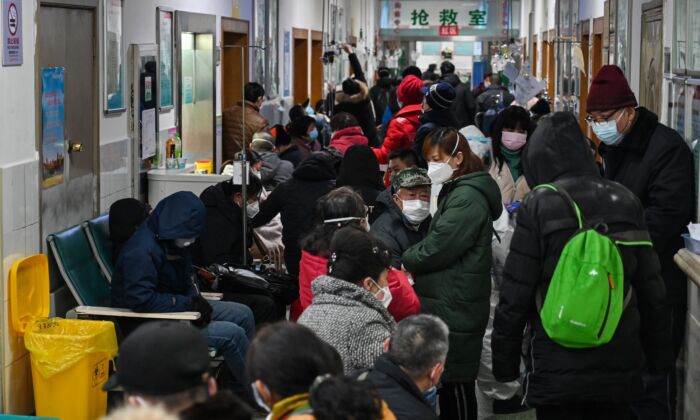 People are waiting for medical attention at Wuhan Red Cross Hospital in Wuhan, China on Jan. 25, 2020. (Hector Retamal/AFP via Getty Images)