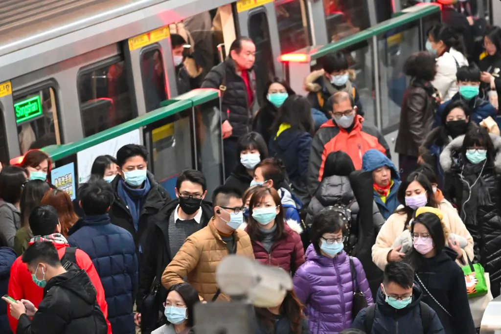 Mask-clad commuters get off a train at a Mass Rapid Transit (MRT) stop in Taipei following the Lunar New Year holidays on Jan. 30, 2020. (Sam Yeh/AFP via Getty Images)