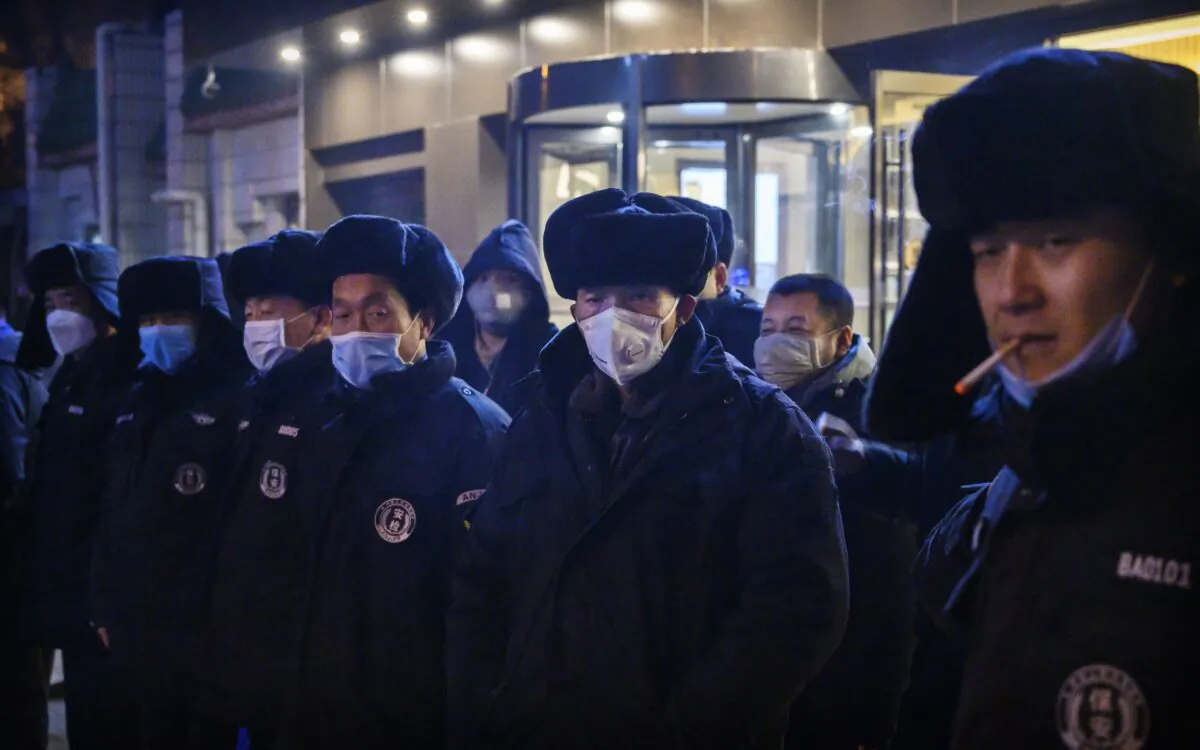 Chinese security guards line up before duty in Beijing, China, on Feb. 9, 2020. (Kevin Frayer/Getty Images)