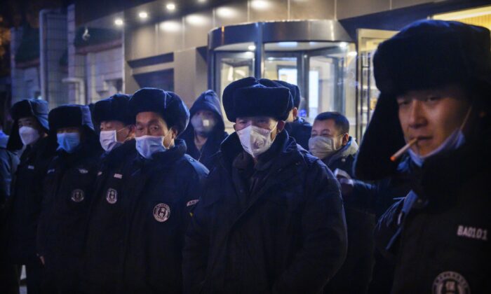 Chinese security guards line up before duty in Beijing, China, on Feb. 9, 2020. (Kevin Frayer/Getty Images)