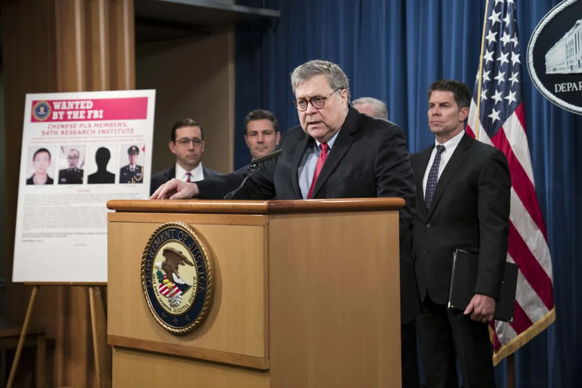 WASHINGTON, DC - FEBRUARY 10: Attorney General William Barr participates in a press conference at the Department of Justice along with DOJ officials on February 10, 2020 in Washington, DC. Barr announced the indictment of four members of China's military on charges of hacking into Equifax Inc. and stealing data from millions of Americans. (Photo by Sarah Silbiger/Getty Images)