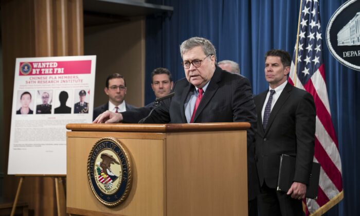 WASHINGTON, DC - FEBRUARY 10: Attorney General William Barr participates in a press conference at the Department of Justice along with DOJ officials on February 10, 2020 in Washington, DC. Barr announced the indictment of four members of China's military on charges of hacking into Equifax Inc. and stealing data from millions of Americans. (Photo by Sarah Silbiger/Getty Images)