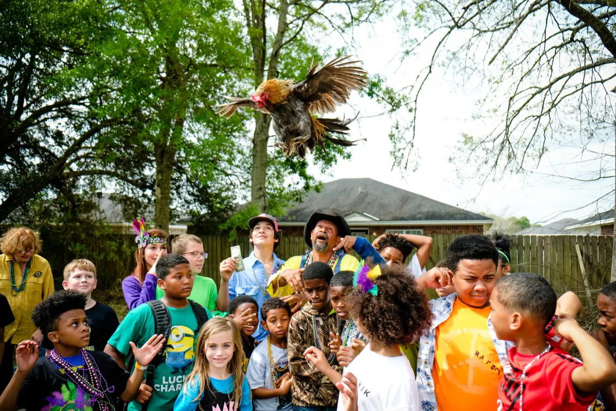 At the Iowa Chicken Run, a chicken is set loose, and the child who retrieves it receives a $5 reward. (LindseyJanies.com)