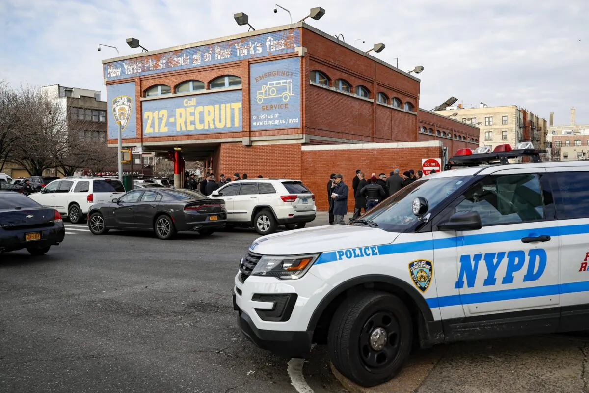 New York City police officers work the scene of a police involved shooting outside the 41st precinct in New York on Feb. 9, 2020. (John Minchillo/AP Photo)