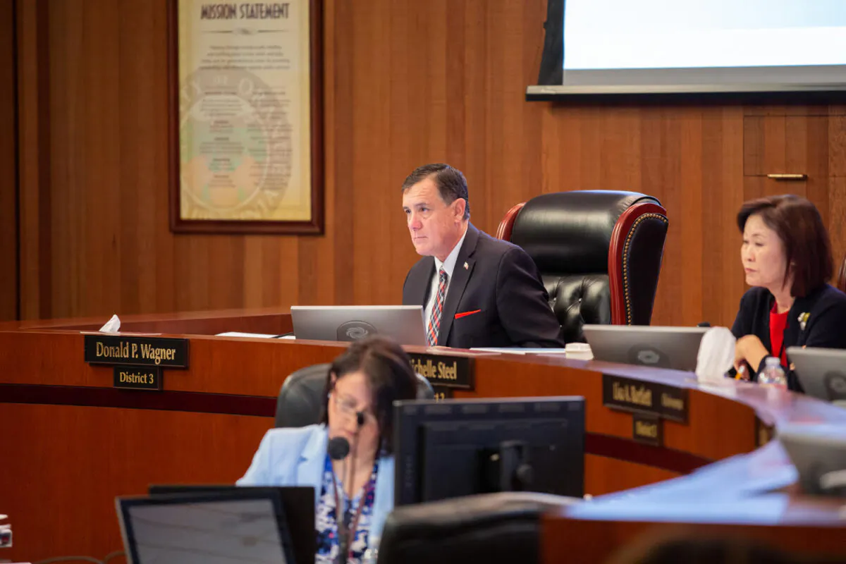 Supervisor Donald Wagner and former chairwoman Michelle Steel, right, attend a meeting of the Orange County Board of Supervisors in Santa Ana, Calif. (Courtesy of Donald P. Wagner)