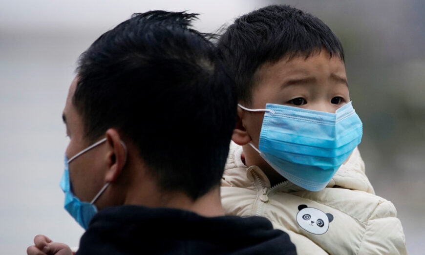 Passengers wearing masks walk outside the Shanghai railway station in Shanghai, China, as the country is hit by an outbreak of the new coronavirus, Feb. 8, 2020. (REUTERS/Aly Song)