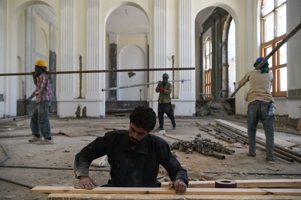 Afghan laborers work on the renovation of Darulaman Palace in Kabul on Aug. 1, 2019. (WAKIL KOHSAR/AFP via Getty Images)