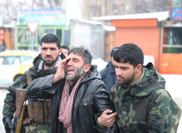 An Afghan man reacts- suicide attack in Kabul, Afghanistan