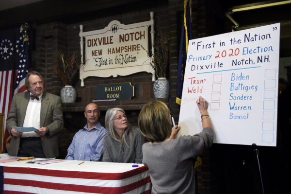 From left, moderator Tom Tillotson, supervisor of the checklist Joe Casey and town clerk Deborah Tillotson look on as Coralie Stepanian marks a Republican write-in vote