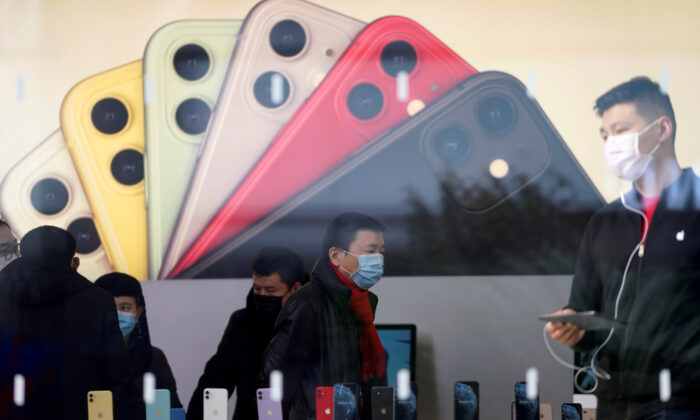 People wearing protective masks are seen in an Apple Store, as China is hit by an outbreak of the new coronavirus, in Shanghai, China, on Jan. 29, 2020. (Aly Song/Reuters)