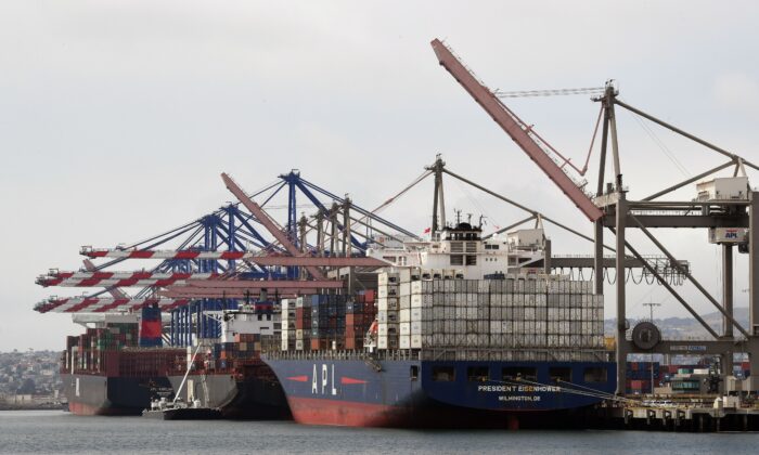 Shipping containers are unloaded at the Port of Los Angeles in Long Beach, California on May 14, 2019. (Mark Ralston/AFP via Getty Images)