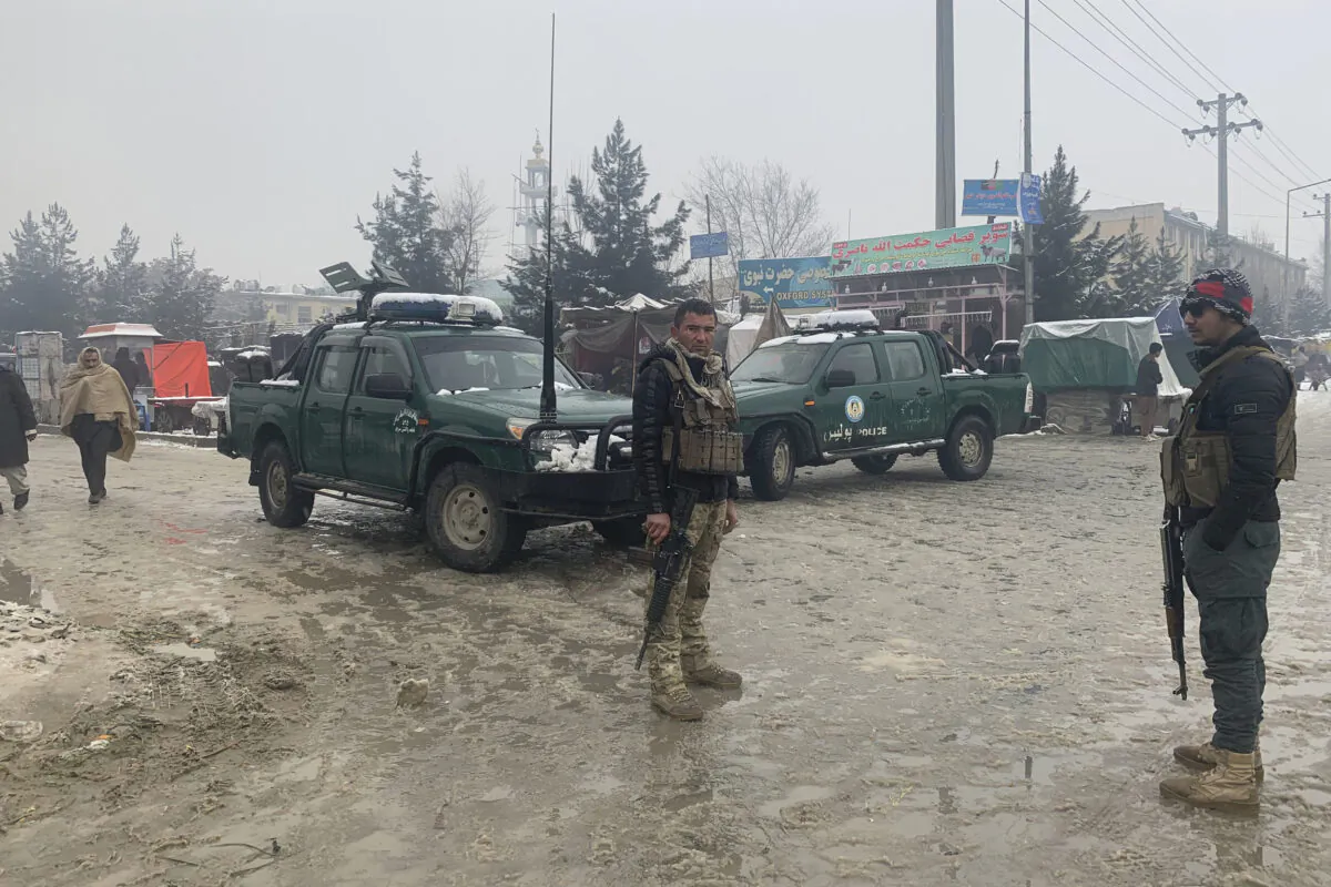 Afghan police arrive at the site of an explosion near the military academy in Kabul, Afghanistan on Feb. 11, 2020. (Rahmat Gul/AP)