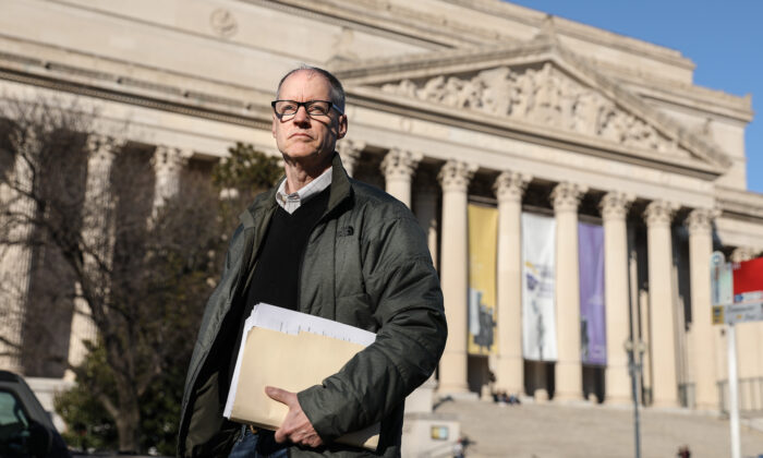 Don Lueders, a former government contractor and certified records manager, stands in front of the National Archives Building in Washington, on Feb. 8, 2020. (Samira Bouaou/Epoch Times)