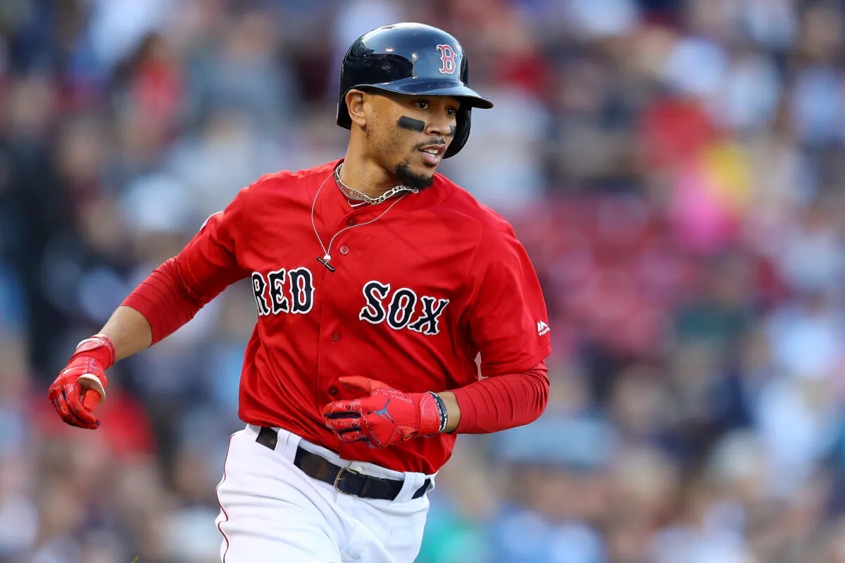 Mookie Betts #50 of the Boston Red Sox runs to first base during the fifth inning against the Baltimore Orioles at Fenway Park in Boston, Massachusetts on Sept. 29, 2019. (Maddie Meyer/Getty Images)