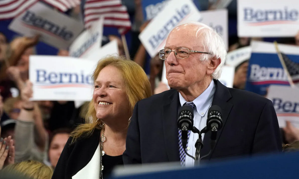 Democratic presidential hopeful Vermont Senator Bernie Sanders (I-Vt.) arrives, flanked by his wife Jane O'Meara Sanders, to speak at a Primary Night event at the SNHU Field House in Manchester, New Hampshire, on Feb. 11, 2020.  Timothy A. Clary/AFP via Getty Images