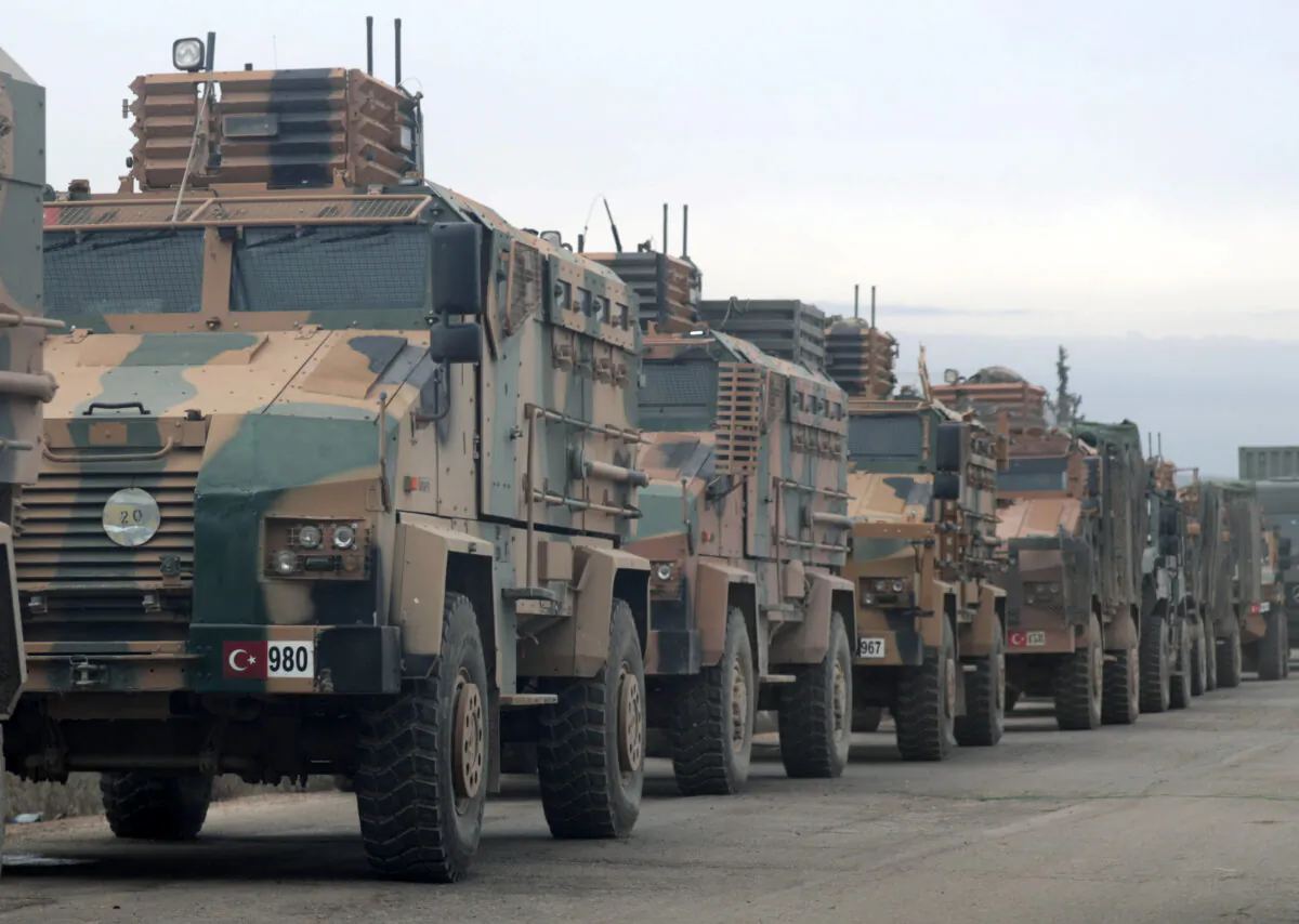 Turkish military vehicles are seen in Hazano near Idlib, Syria, on Feb. 11, 2020. (Khalil Ashawi/Reuters)