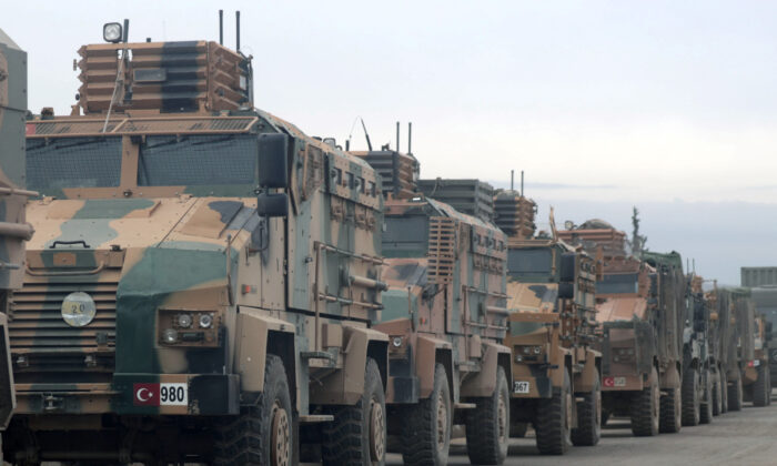 Turkish military vehicles are seen in Hazano near Idlib, Syria, on Feb. 11, 2020. (Khalil Ashawi/Reuters)