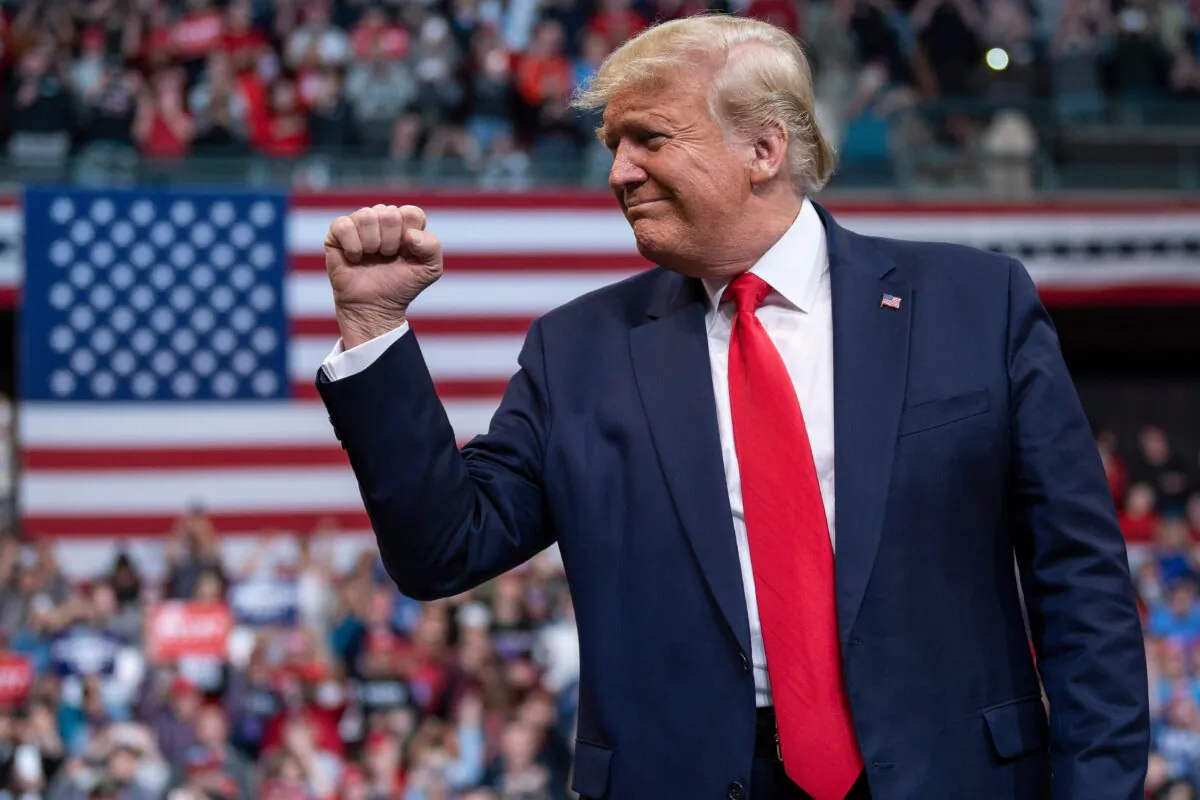 U.S. President Donald Trump gestures as he arrives to speak during a rally in Manchester, New Hampshire on Feb. 10, 2020. (Jim Watson/AFP via Getty Images)
