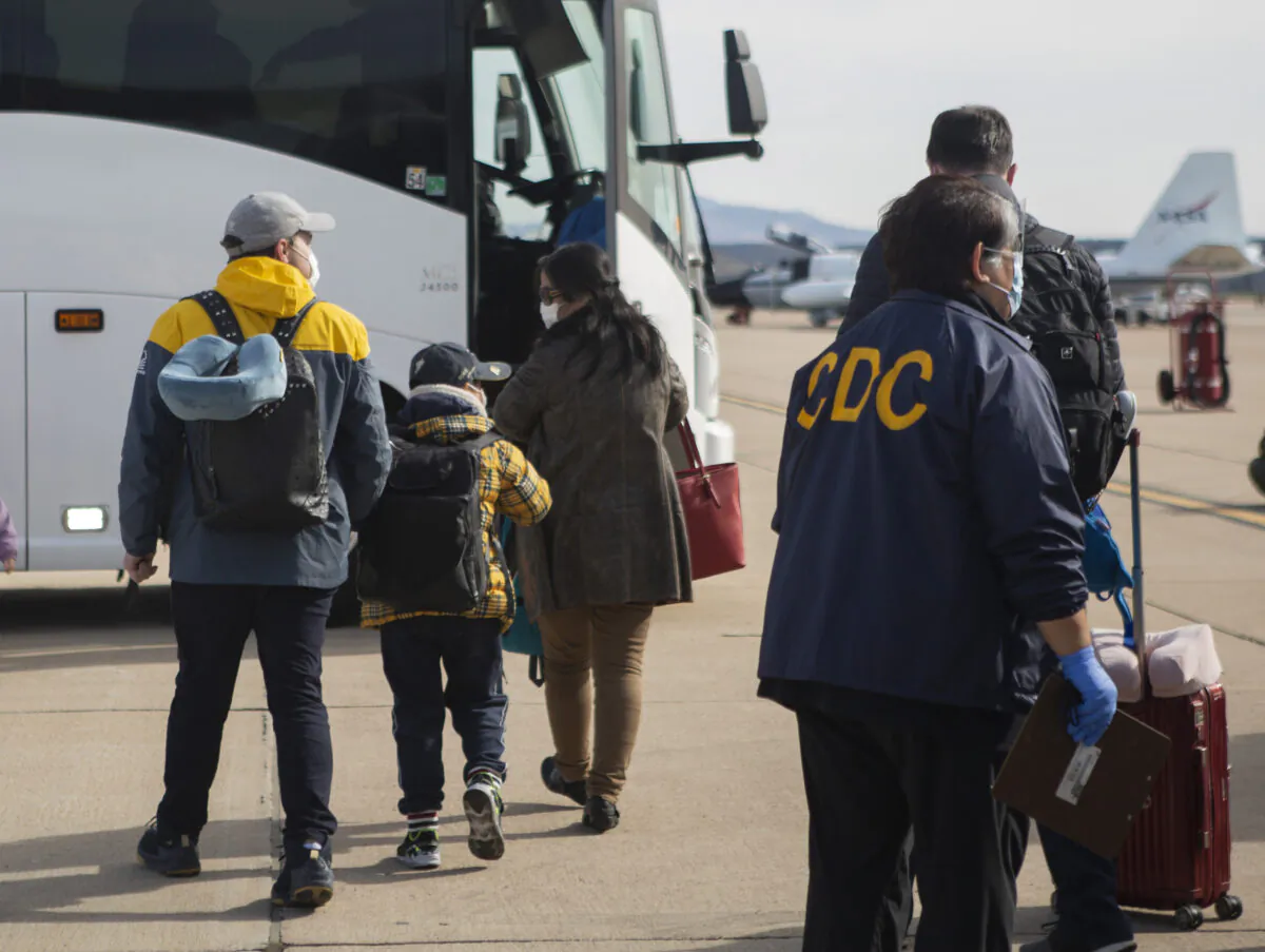 ThisFeb. 5, 2020, file photo provided by the U.S. Department of Health and Human Services shows evacuees from China arriving at Marine Corps Air Station in Miramar, Calif. (Krysten I. Houk/U.S. Department of Health and Human Services via AP, File)