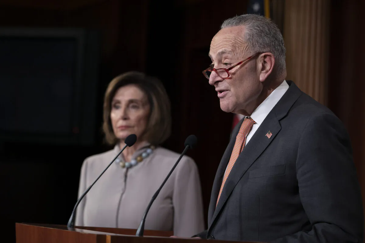 Senate Minority Leader Chuck Schumer (D-N.Y.) and House Speaker Nancy Pelosi (D-Calif.) speak in Washington on Feb. 11, 2020. (Tasos Katopodis/Getty Images)