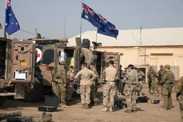 Members of the Task Group Taji X Quick Reaction Force explain their mission and capabilities to the NATO command team on Camp Taji, Iraq, Feb. 7, 2020. (Army Spc. Caroline Schofer/U.S. Department of Defense)