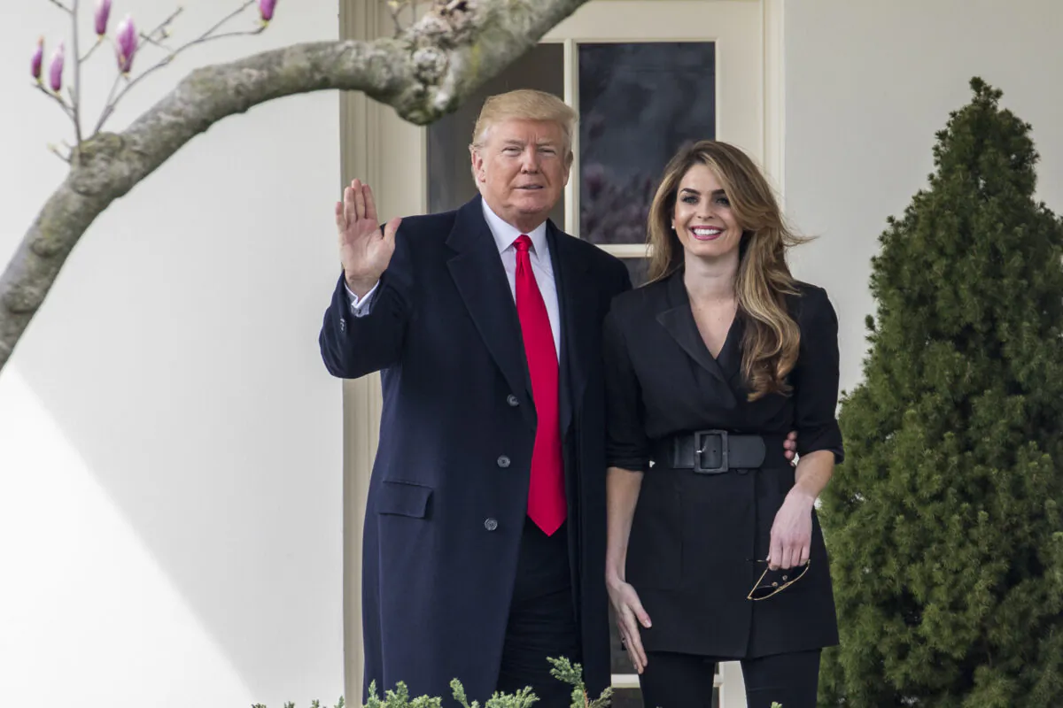Then- President Donald Trump poses with then-White House communications director Hope Hicks before he boards Marine One on the South Lawn of the White House in Washington on Jan. 1, 2018. (Samira Bouaou/The Epoch Times)