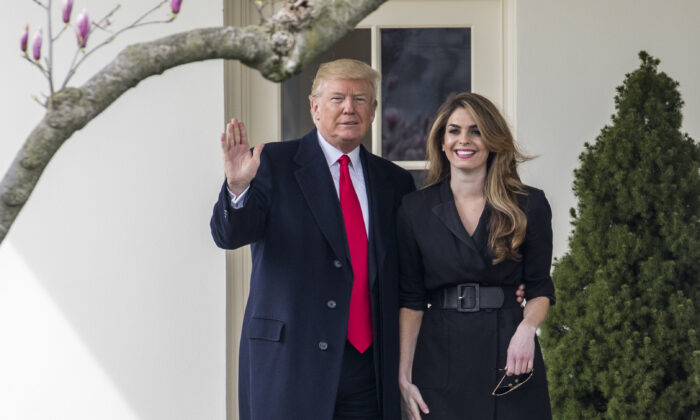 President Donald Trump poses with then White House communications director Hope Hicks before he boards Marine One on the South Lawn of the White House in Washington on Jan. 1, 2018. (Samira Bouaou/The Epoch Times)