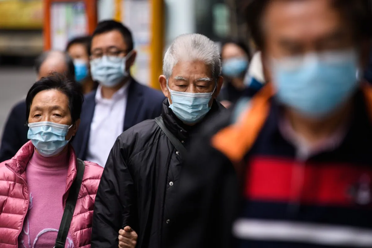 People in Hong Kong wear protective masks on Feb. 3, 2020. (Anthony Wallace/AFP via Getty Images)