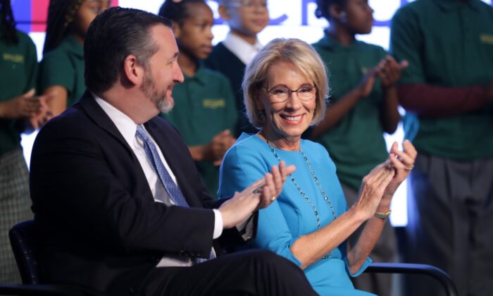 Education Secretary Betsy DeVos (R) and Sen. Ted Cruz (R-Texas) participate in an event about their proposal for Education Freedom Scholarships at the Education Department headquarters in Washington on Feb. 28, 2019. According to the department, the scholarships will be funded with $5 billion of federal tax credit for donations to scholarships for private schools and other educational programs and would "significantly expand education freedom for millions of students and families across the country." (Chip Somodevilla/Getty Images)