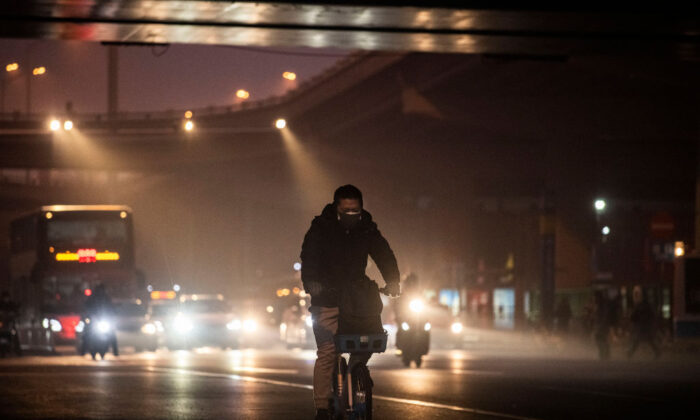 A Chinese man wears a protective mask in Beijing on Feb. 13, 2020. (Kevin Frayer/Getty Images)