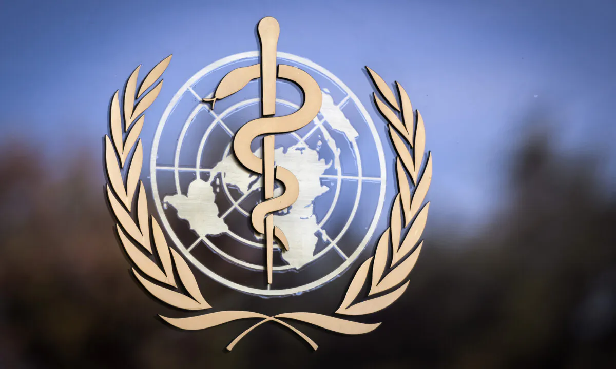 The logo of the World Health Organization (WHO) is pictured on the facade of the WHO headquarters in Geneva, Switzerland, on Oct. 24, 2017. (Fabrice Coffrini/ Getty Images)