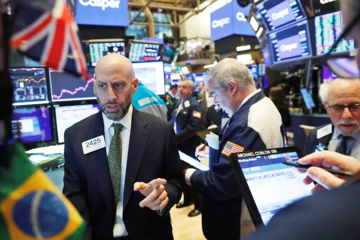 Traders work on the floor of the New York Stock Exchange shortly after the opening bell in New York on Feb. 6, 2020. (Reuters/Lucas Jackson)