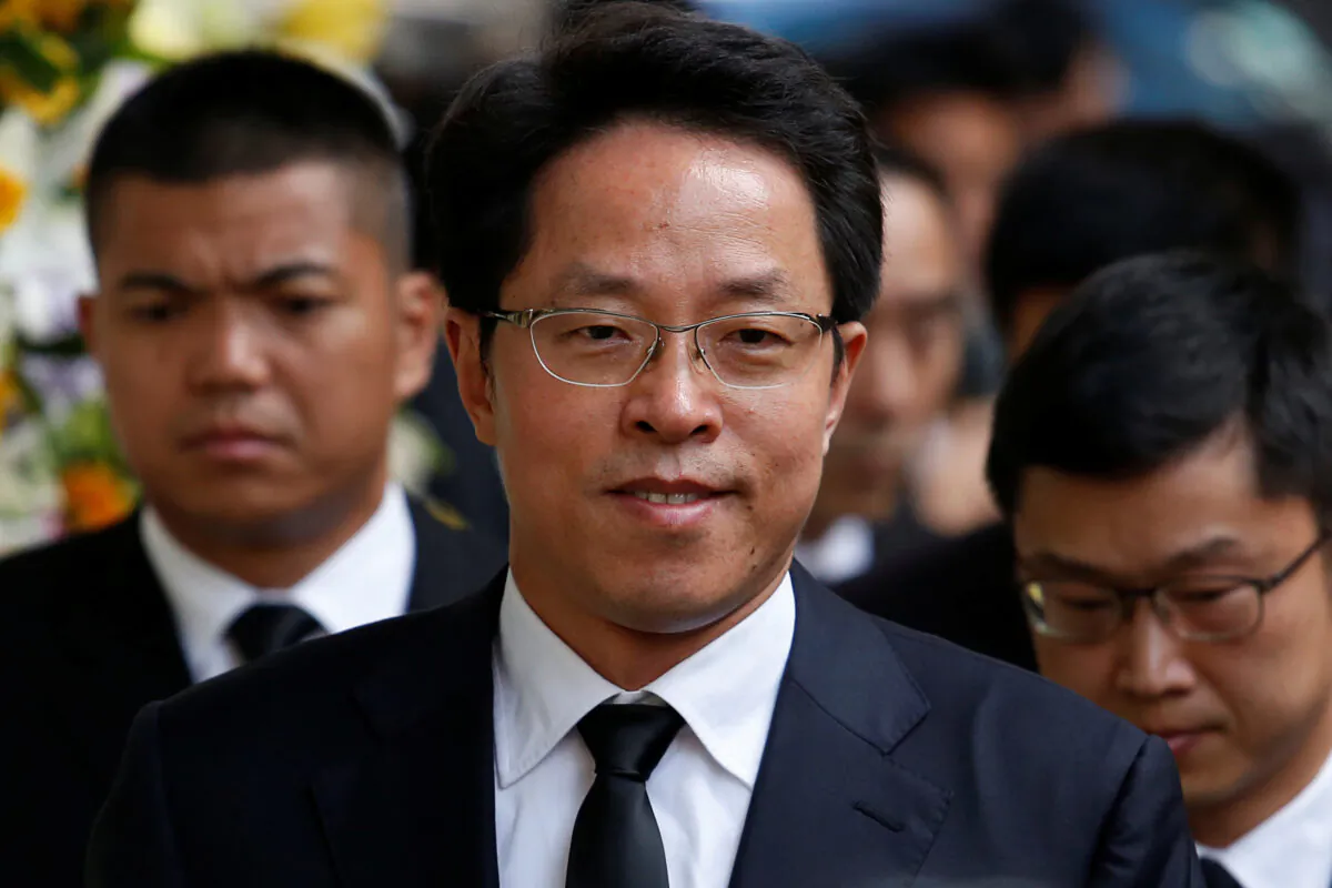 Zhang Xiaoming, Director of China's Liaison Office in Hong Kong, attends the funeral of Cheng Yu-tung, founder of Hong Kong property group New World Development, in Hong Kong, China on Oct. 13, 2016. (Bobby Yip/Reuters)