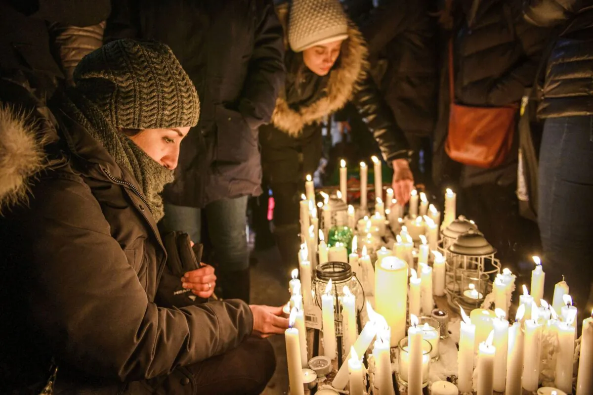 Members of Montreal's Iranian community attend a vigil in downtown Montreal on Jan. 9, 2020, to mourn victims of the Iranian air crash. Foreign Minister Francois-Philippe Champagne says he sees progress in persuading Iran to relinquish the black boxes from the Ukrainian jetliner that crashed near Tehran on Jan. 8. (The Canadian Press/Andrej Ivanov)
