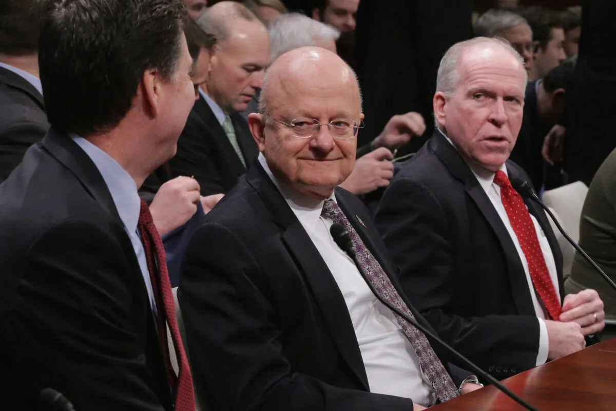 (L-R) FBI Director James Comey, Director of National Intelligence James Clapper and Central Intellegence Agency Director John Brennan, prepare to testify before the House Permanent Select Committee on Intelligence on Feb. 25, 2016. (Chip Somodevilla/Getty Images)