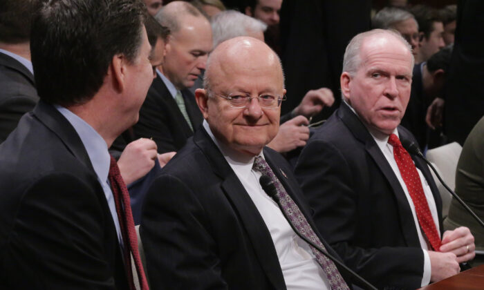(L-R) FBI Director James Comey, Director of National Intelligence James Clapper and Central Intellegence Agency Director John Brennan, prepare to testify before the House Permanent Select Committee on Intelligence on Feb. 25, 2016. (Chip Somodevilla/Getty Images)