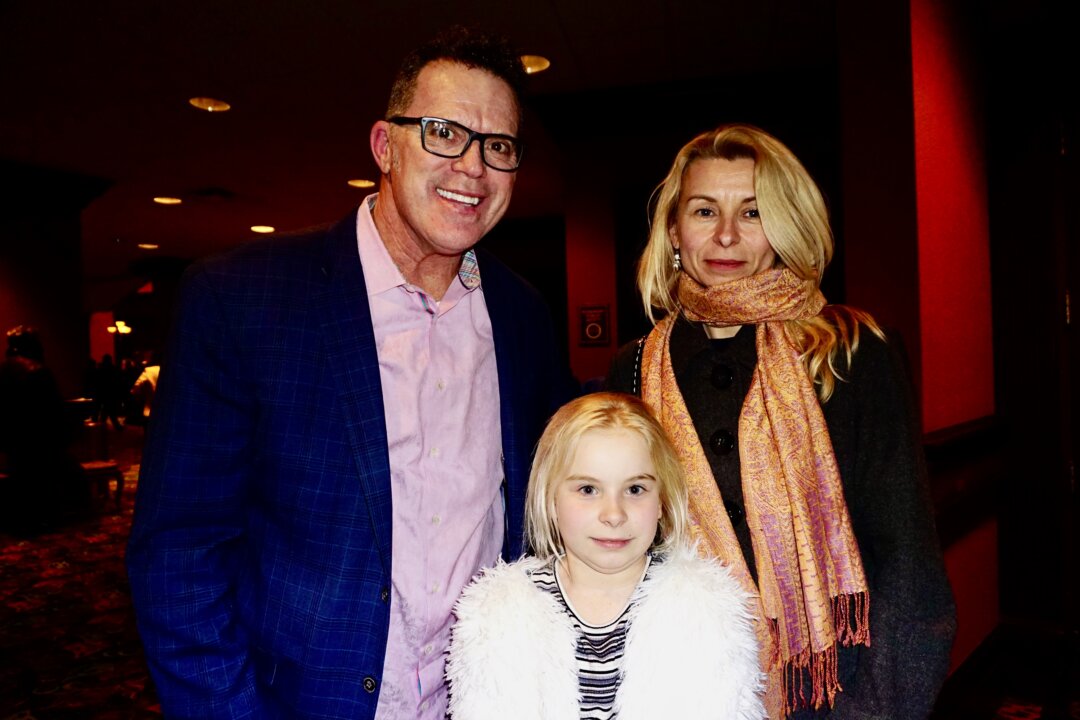 Tim Tyrell, Daiva Mazuolyt, and her daughter, enjoyed Shen Yun at the Rosemont Theatre in Rosemont, Illinois, on Feb. 14, 2020. (Catherine Wen/The Epoch Times)