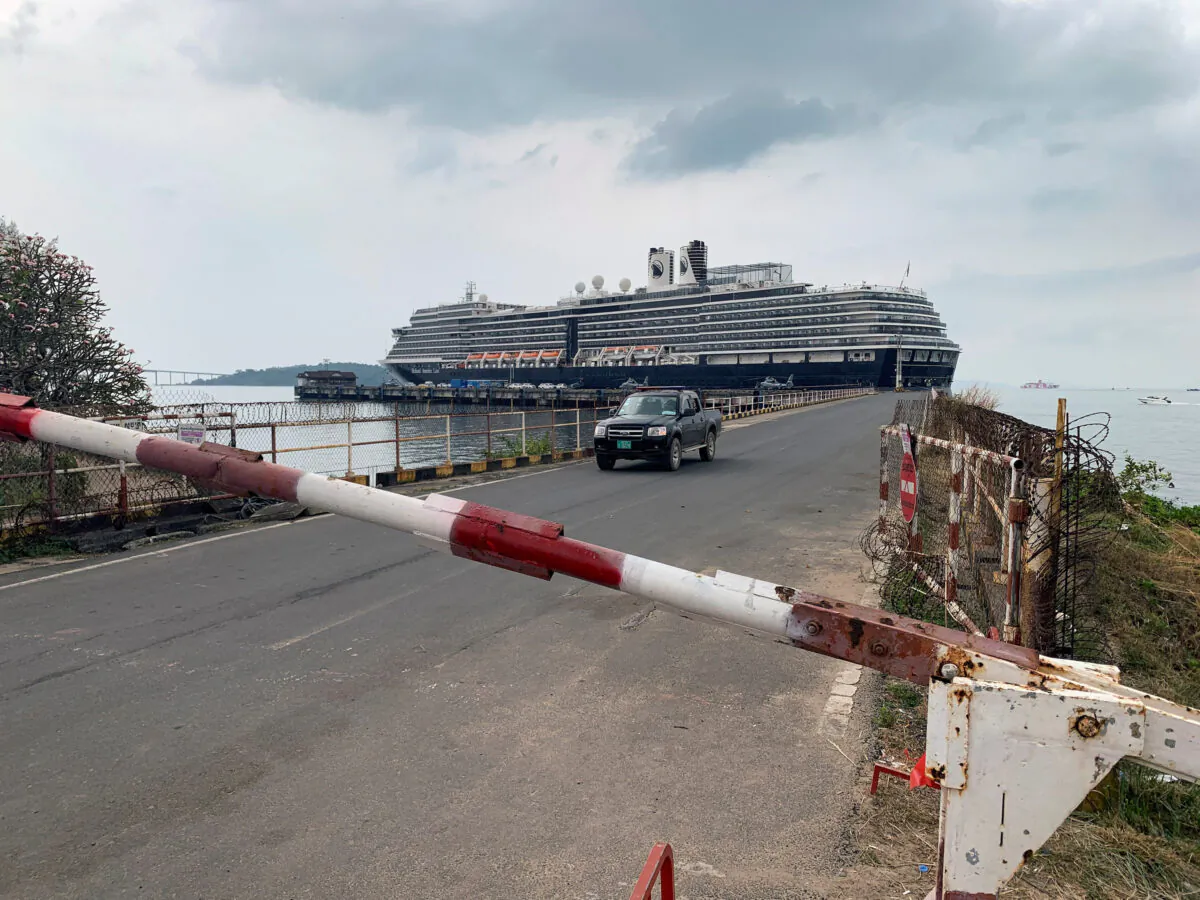 A general view of the security checkpoint in front of cruise ship MS Westerdam at dock in the Cambodian port of Sihanoukville, Cambodia, on Feb. 17, 2020. (Clare Baldwin/Reuters)