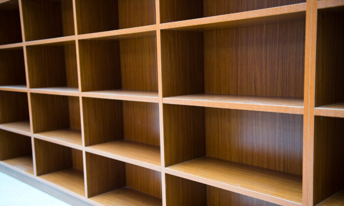 Stock image showing empty bookshelves. (Illustration/Shutterstock)