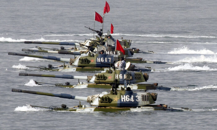 Amphibious tanks of the Chinese People's Liberation Army move to land on a beach during the second phase of the Sino-Russian joint military exercise near Qingdao of Shandong Peninsular, China, on August 22, 2005. (Getty Images)