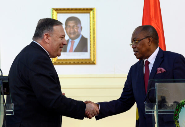 U.S. Secretary of State Mike Pompeo and Angolan Foreign Minister Manuel Domingos Augusto shake hands after a news conference the at Ministry of Foreign Affairs in Luanda, Angola February 17, 2020. (Andrew Caballero-Reynolds/Pool via Reuters)