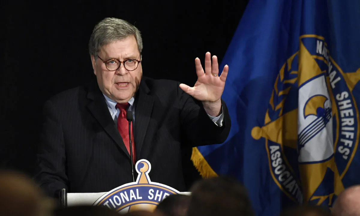 Attorney General William Barr waves as he walks on stage to speak at the National Sheriffs' Association Winter Legislative and Technology Conference in Washington on Feb. 10, 2020. (Susan Walsh/AP Photo)