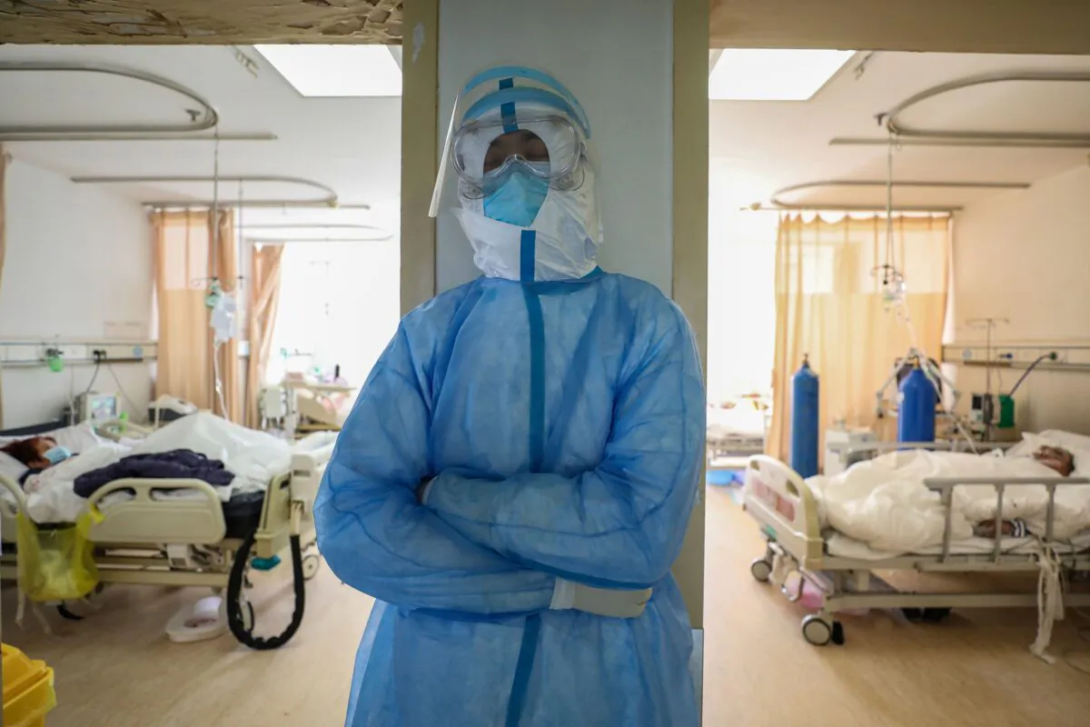 A medical staff member  rests at the isolation ward of the Wuhan Red Cross Hospital in Wuhan, China, on Feb. 16, 2020. (STR/AFP via Getty Images)