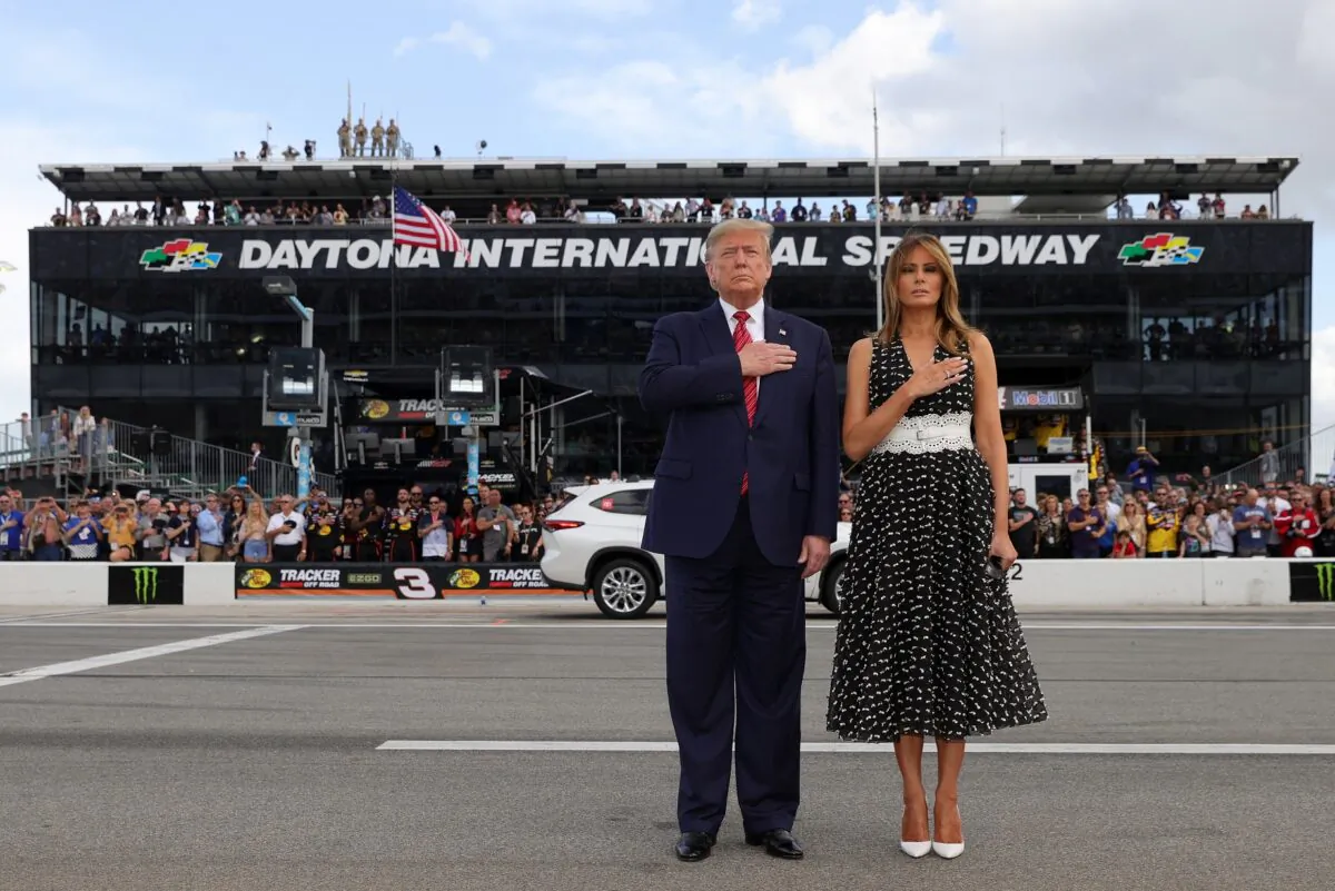 President Donald Trump and First Lady Melania Trump stand for the national anthem prior to the NASCAR Cup Series 62nd Annual Daytona 500 at Daytona International Speedway in Daytona Beach, Fla., on Feb. 16, 2020. (Chris Graythen/Getty Images)